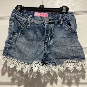 Lace trimmed cut off denim shorts